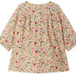 The Bonpoint Baby Girls’ and Girls’ Félicie Dress with Smocking and Hand Embroidery is a long-sleeved dress adorned with a floral pattern, featuring intricate hand-embroidered smocking, a gathered yoke, and button closures on the upper back.