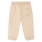 The Bonpoint Baby Girls’ and Girls’ Bambo Beige Jogging Bottoms are crafted from soft organic cotton fleece, featuring a single back pocket adorned with a pink embroidered cherry, shown against a white background.