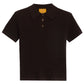 The Shrunken Cashmere Polo by Guest in Residence is a dark brown, short-sleeve ribbed polo with a collar, two-button placket, and a yellow brand label inside the neckline.