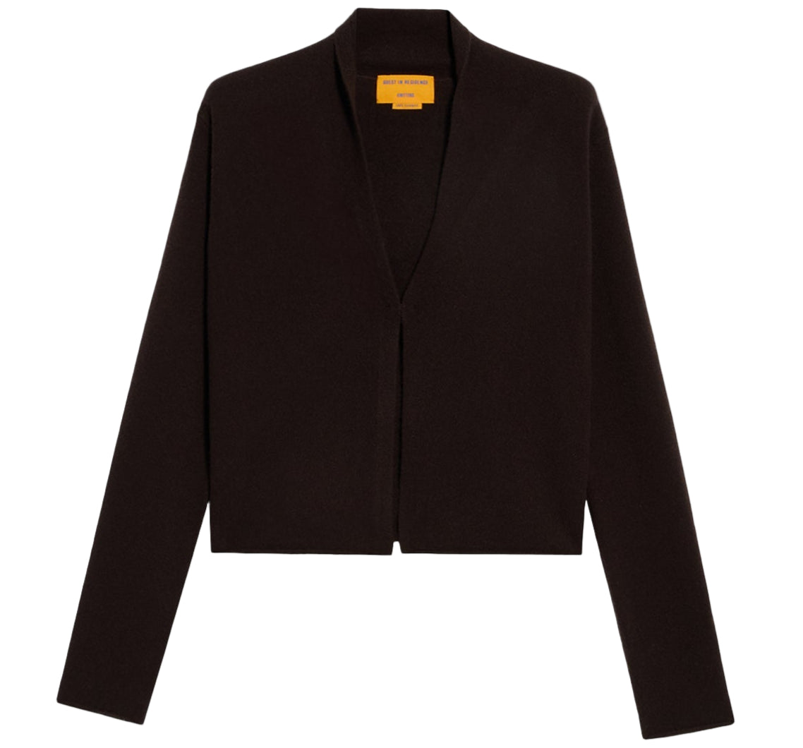 The Stealth Cardigan by Guest in Residence is a black, long-sleeve, open front sweater with a minimalistic design and straight hem, shown against a plain white background.