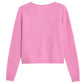 The Grizzly Cashmere Cardigan by Guest in Residence, a light pink women's knitwear sweater with long sleeves and a subtle brushed finish, is displayed flat with the back side facing up.