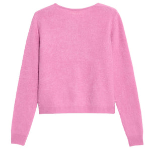The Grizzly Cashmere Cardigan by Guest in Residence, a light pink women's knitwear sweater with long sleeves and a subtle brushed finish, is displayed flat with the back side facing up.