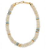 The Laguna Necklace by Lizzie Fortunato features round white and pale blue recycled glass beads with gold spacers, finished with a gold hook clasp.