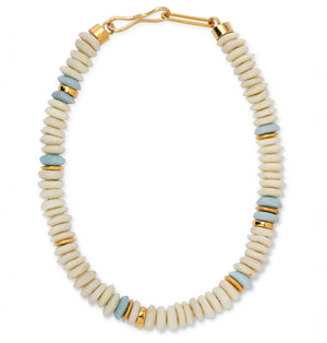 The Laguna Necklace by Lizzie Fortunato features round white and pale blue recycled glass beads with gold spacers, finished with a gold hook clasp.