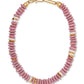 The Laguna Necklace by Lizzie Fortunato features pink, gold, and off-white recycled glass beads in a repeating pattern, accented with a gold clasp.