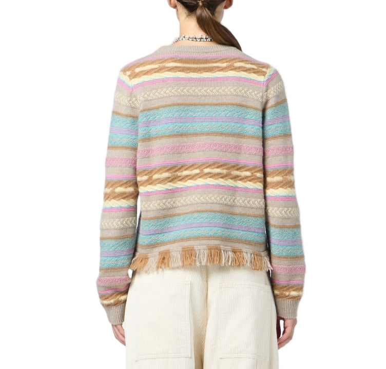 A person wearing the Guest in Residence Western Stripe Crew sweater with a fringe hem and light-colored pants, shown from the back against a white background.