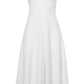 The Proenza Schouler Juno Dress is a sleeveless, white, ankle-length dress with a fitted waist and flared skirt, featuring a subtle dotted pattern and a delicate Broderie Anglaise embroidered overlay.