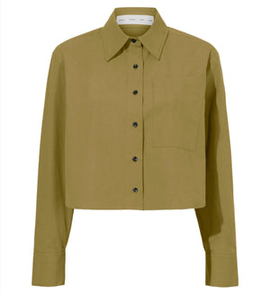 A khaki green long-sleeve button-up Proenza Schouler Alma Shirt with a front pocket, featuring black buttons and a classic collar, all crafted from soft peached poplin for an elegant touch.