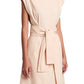 The Proenza Schouler White Label Caro Dress Brushed Poplin showcases a chic sleeveless A-line design in beige with a self-tie waist belt, ideal for highlighting your figure against a crisp white backdrop.