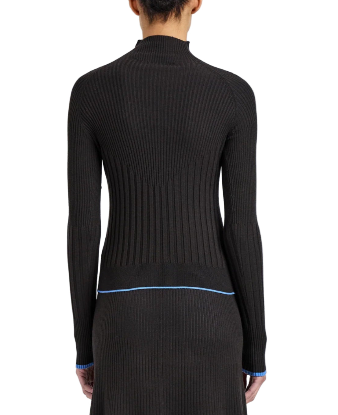 A person is seen from the back wearing the fitted, long-sleeve Daniella Sweater by Proenza Schouler White Label in ribbed black Souffle Knit with blue trim at the cuffs and hem.