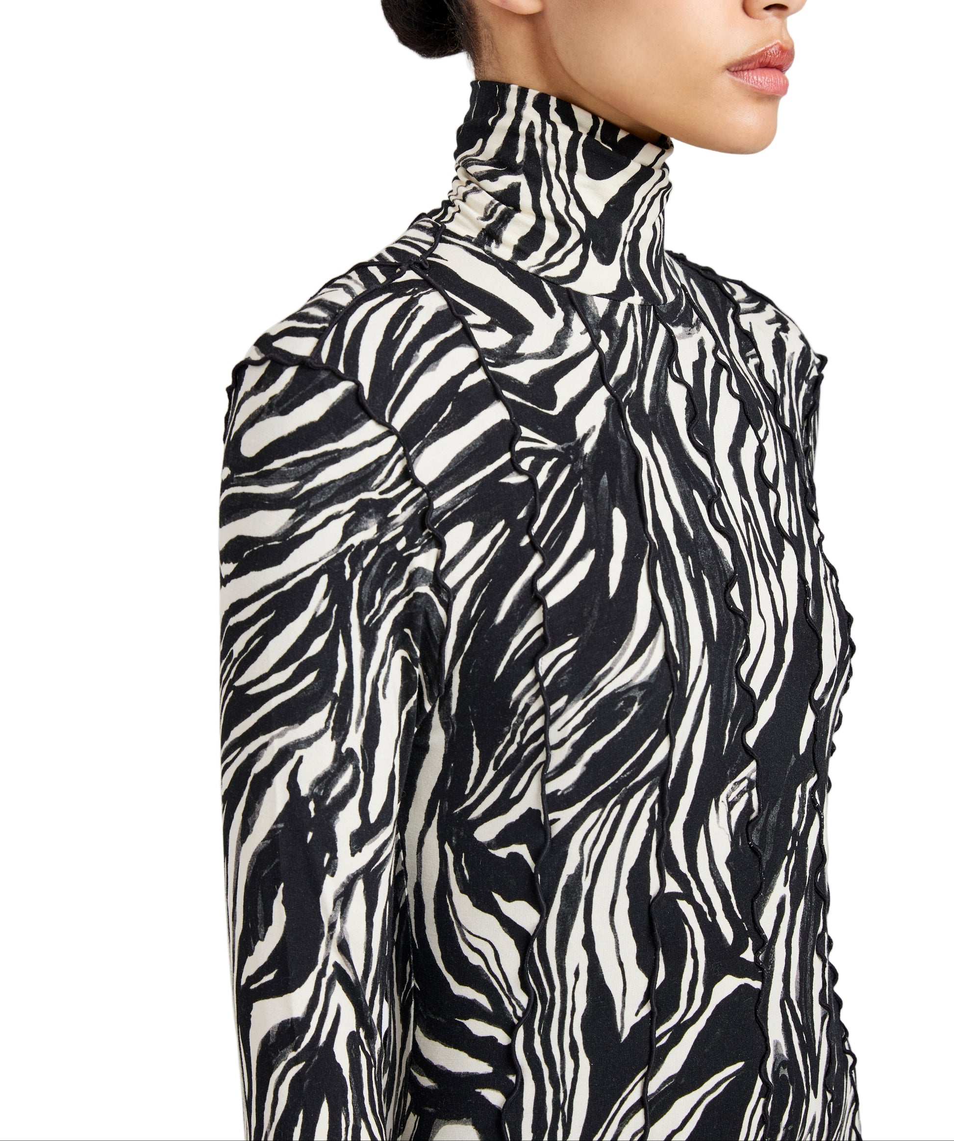 A woman wearing the Mabel Marble Jersey Dress by Proenza Schouler White Label, featuring long sleeves and a black and white abstract zebra print.