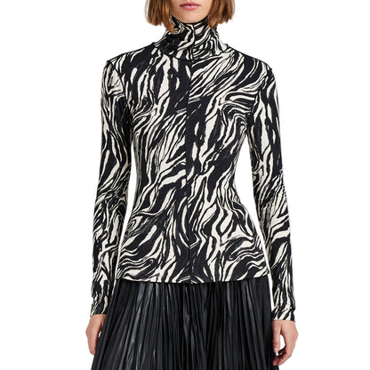 A person wears the Audrey Marble Jersey Top by Proenza Schouler White Label, featuring a slim fit and monochrome print, paired with a black pleated skirt for an abstract-inspired look.