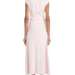 A woman faces away, wearing the light pink Miranda Dress by Proenza Schouler White Label. This linen slub, short-sleeve, ankle-length dress has an A-line silhouette and is styled with black flat sandals and round earrings.