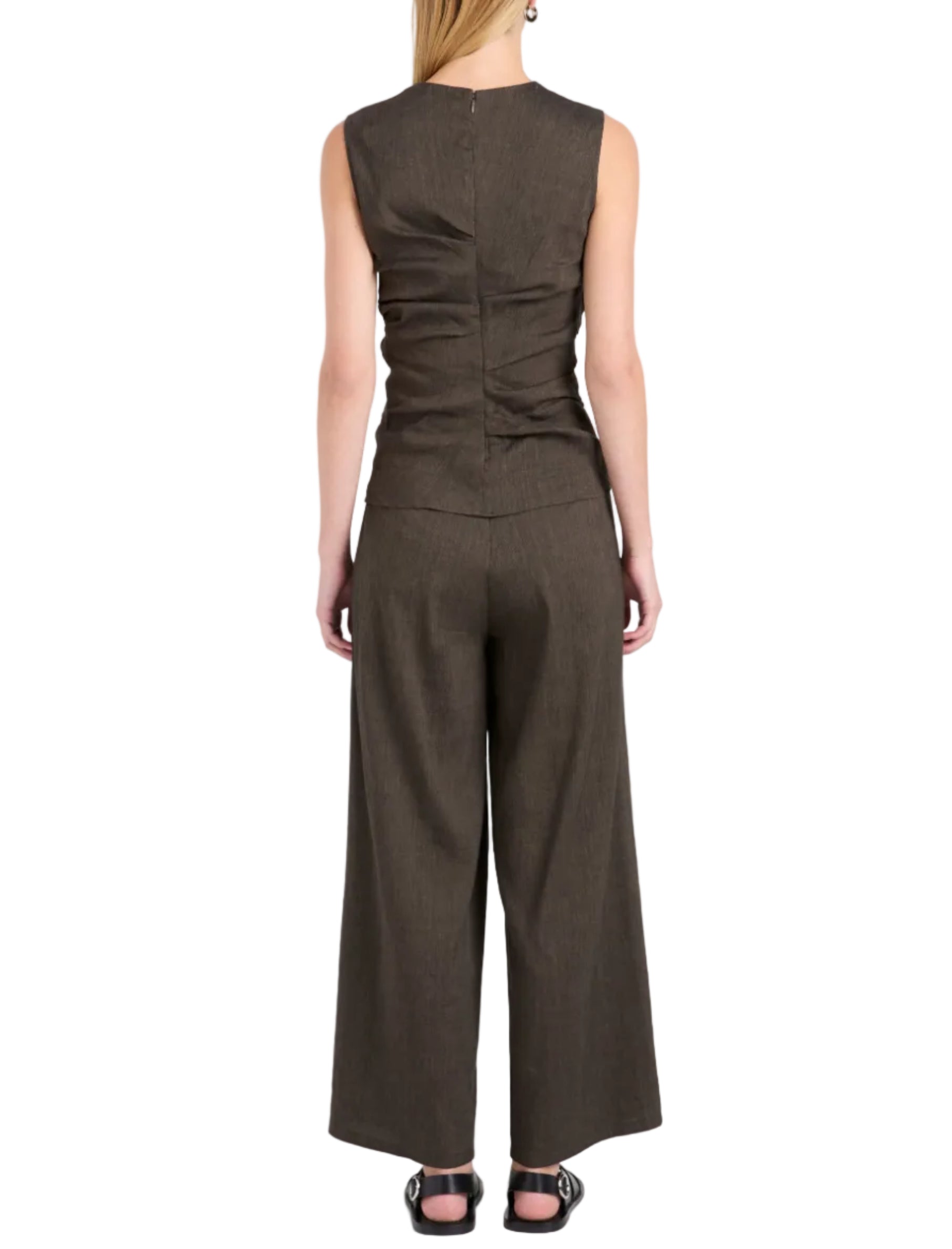 A person is seen from the back against a white background, wearing the Proenza Schouler White Label Anoushka Slub Linen Top in dark brown, styled with matching wide-leg pants for a sleeveless look.