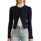 A navy blue Proenza Schouler White Label Marci Cardigan with a wavy Ric Rac Cotton texture, worn over a cream-colored mock-neck top and light-wash jeans.