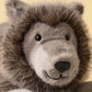 Close-up of Jellycat’s Ulrich Wolf, a gray stuffed animal with black eyes, fluffy fur, and a stitched smile against a plain background.
