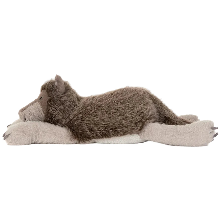 Ulrich Wolf by Jellycat is a plush wolf toy lying on its stomach, with soft gray and brown fur and a relaxed expression.