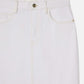 Close-up of the upper half of The Flounce Denim Skirt by Frame, a white denim maxi skirt with front pockets, belt loops, and a button closure.
