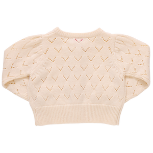 The Girls' Connie Sweater by Pink Chicken features a cream chevron eyelet pattern and puffed sleeves. Shown from the back on a white background, this pointelle cardigan adds delicate texture to any girl's wardrobe.
