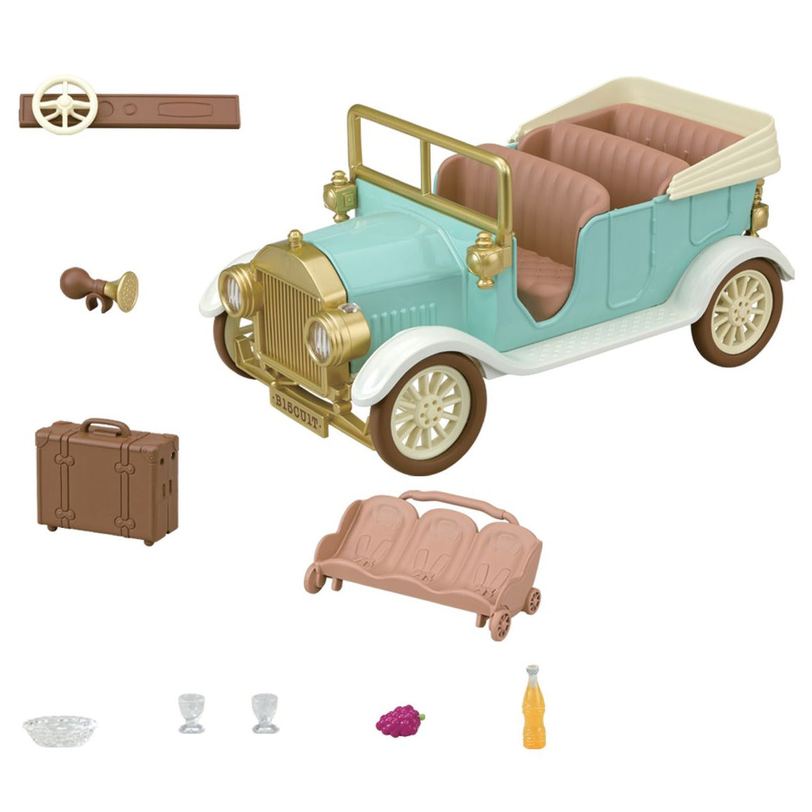 Calico Critters Classic Family Car vintage set featuring toy car accessories such as removable seats, a 10-figure seat, suitcase, steering wheel, horn, dishware, grapes, and a bottle—all artfully arranged on a white background.