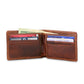 The Smathers & Branson Bi-Fold Wallet, expertly hand-stitched from rich brown leather, displays several credit cards, a driver’s license, and cash neatly organized in its compartments.