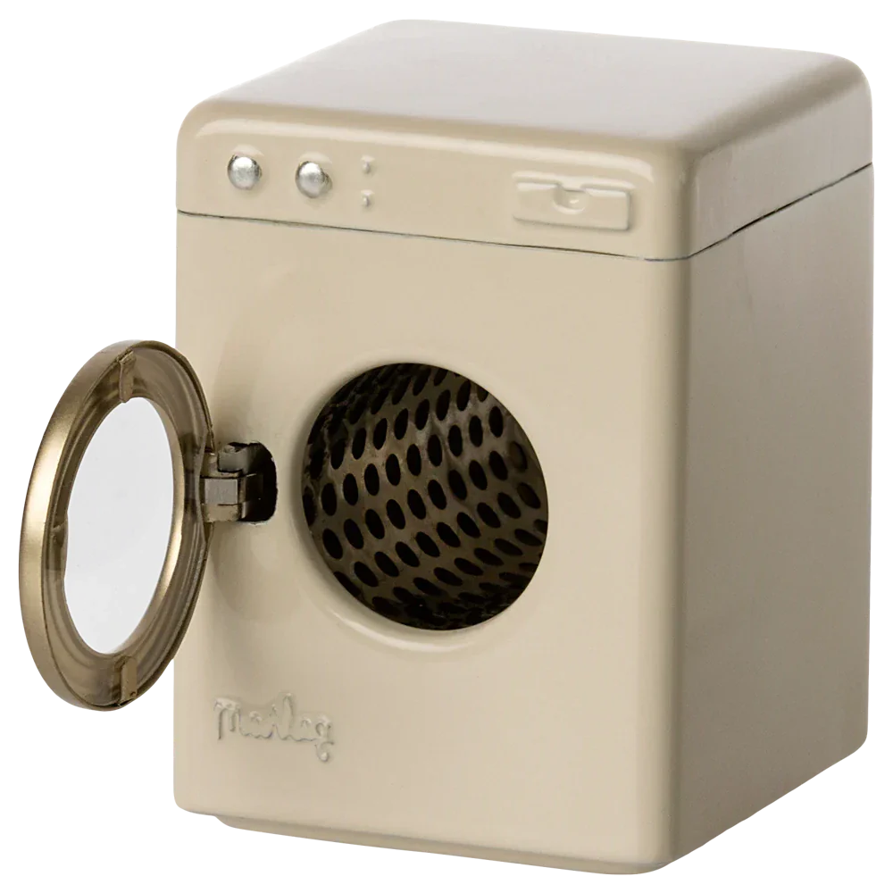 A beige Maileg Washing Machine, Mouse from Maileg, resembling a toy appliance, stands with its front-loading door open.