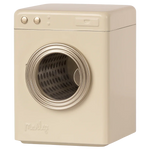 The "Maileg Washing Machine, Miniature" by Maileg is a beige front-loading washing machine featuring a round, transparent door and metal control knobs on the top left.