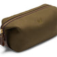 Introducing the Bennett Winch Canvas Wash Bag: a brown canvas wash bag from Bennett Winch that boasts a YKK brass zipper, leather accents, and a subtle embroidered logo on its side.