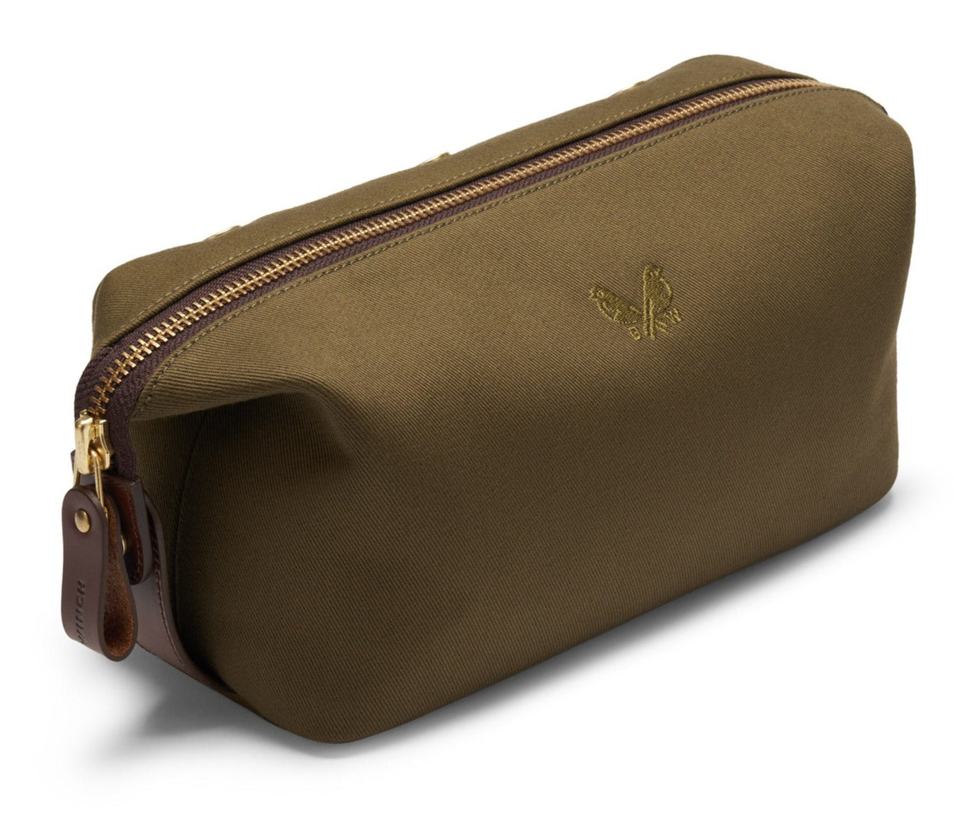 Introducing the Bennett Winch Canvas Wash Bag: a brown canvas wash bag from Bennett Winch that boasts a YKK brass zipper, leather accents, and a subtle embroidered logo on its side.