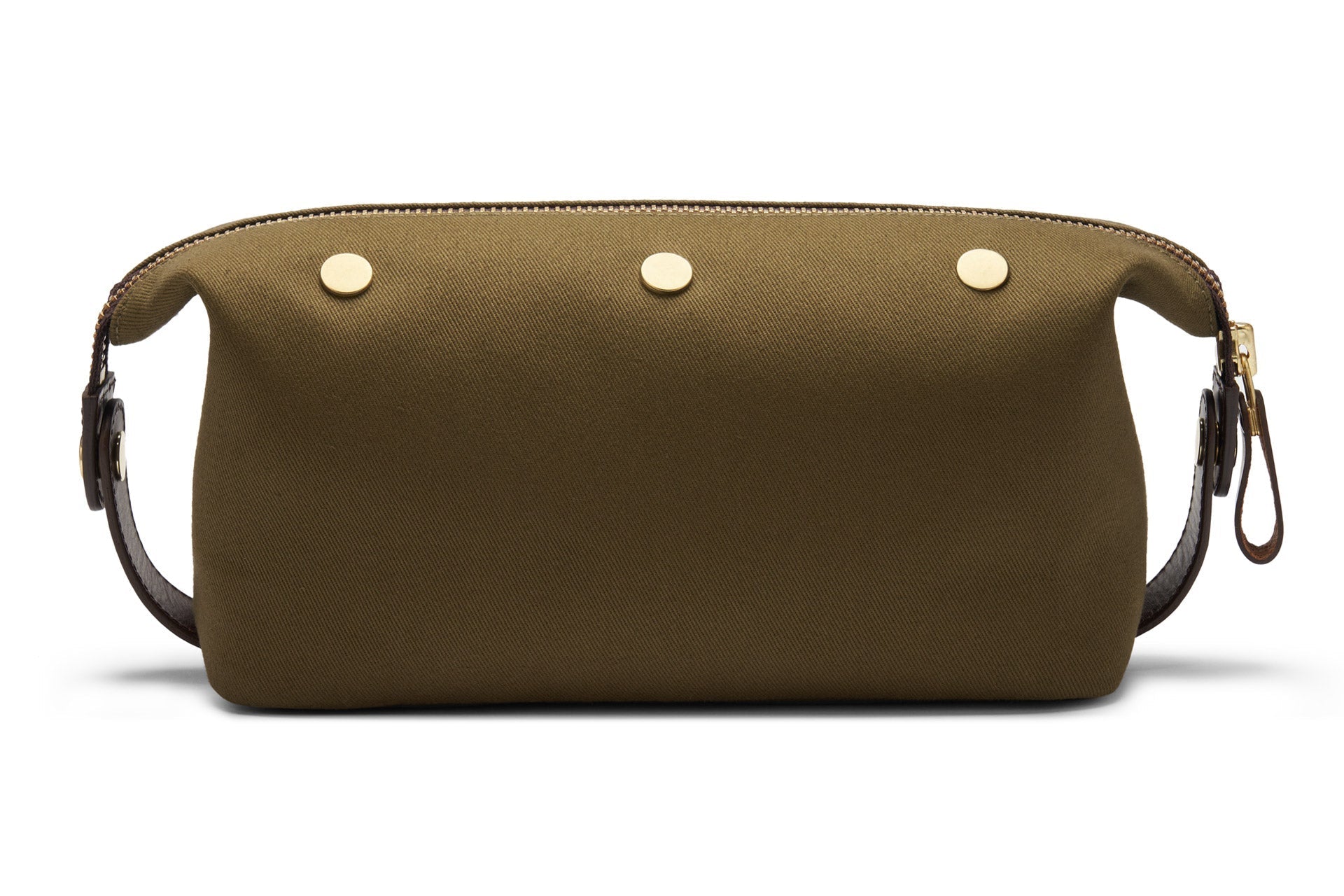 Bennett Winch's Canvas Wash Bag in olive green features a YKK brass zipper, three gold buttons on one side, and is equipped with a brown leather strap at each end.