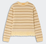 The Western Stripe Crew by Guest in Residence features long sleeves, beige and yellow stripes, textured patterns, and a chic fringed hem.