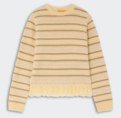 The Western Stripe Crew by Guest in Residence features long sleeves, beige and yellow stripes, textured patterns, and a chic fringed hem.