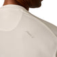 Close-up of a person wearing the Johnnie-O Basin Performance Sun Shirt in cream, featuring "Johnnie-O" text on the back near the shoulder, ideal for staying stylish even during a heat wave.