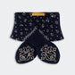 Navy blue knit socks featuring a cream paisley and dot design, neatly folded with a yellow “Guest in Residence” label on the cuff—perfectly paired with your favorite Bandana Bowtie Scarf from Guest in Residence.