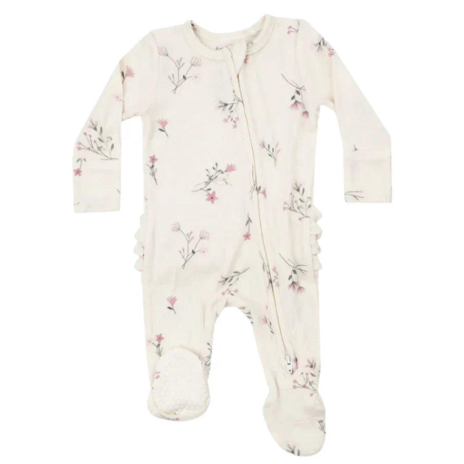 The Angel Dear Wispy Floral Ruffle Back 2-Way Zip Footie is a baby onesie in bamboo fiber featuring the brand's signature nature-themed pattern, adorned with small pink flowers and leaves on a cream background. This design offers both coziness and convenience for little ones.