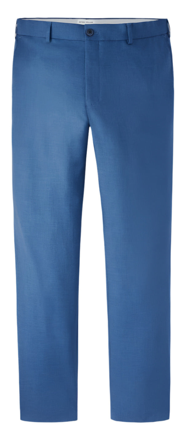 The Peter Millar Charlotte Performance Trouser in blue is made from stretch mélange fabric and features a button and zip closure, belt loops, front crease lines, and a comfort waistband for added ease. Ideal for any professional setting, they offer modern performance.