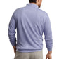 A man wearing the Peter Millar Crown Comfort Pullover in light blue and beige pants, standing with his back to the camera.