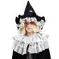 A child wearing a black and silver wizard costume with the Meri Meri Pointed Black Hat featuring star designs, along with a cape adorned with layered ruffles—an ideal Halloween accessory from Meri Meri.