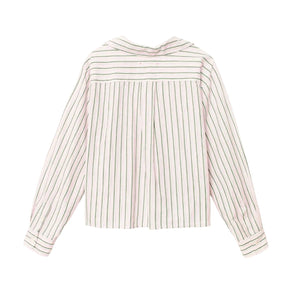 The Wyler Shirt by Xirena is a long-sleeve, white cotton button-up with vertical black stripes. Shown from the back, it features a collar, upper back pleat detailing, and a modern boxy fit for relaxed style.
