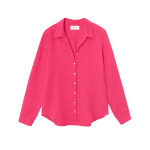 The Xirena Scout Cotton Gauze Shirt, shown flat against a white background, is a bright pink long-sleeve button-up crafted from washed cotton gauze and features a lightweight button-front design with a classic shirttail hem.