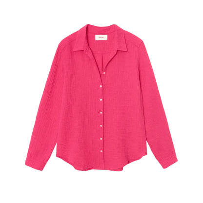 The Xirena Scout Cotton Gauze Shirt, shown flat against a white background, is a bright pink long-sleeve button-up crafted from washed cotton gauze and features a lightweight button-front design with a classic shirttail hem.
