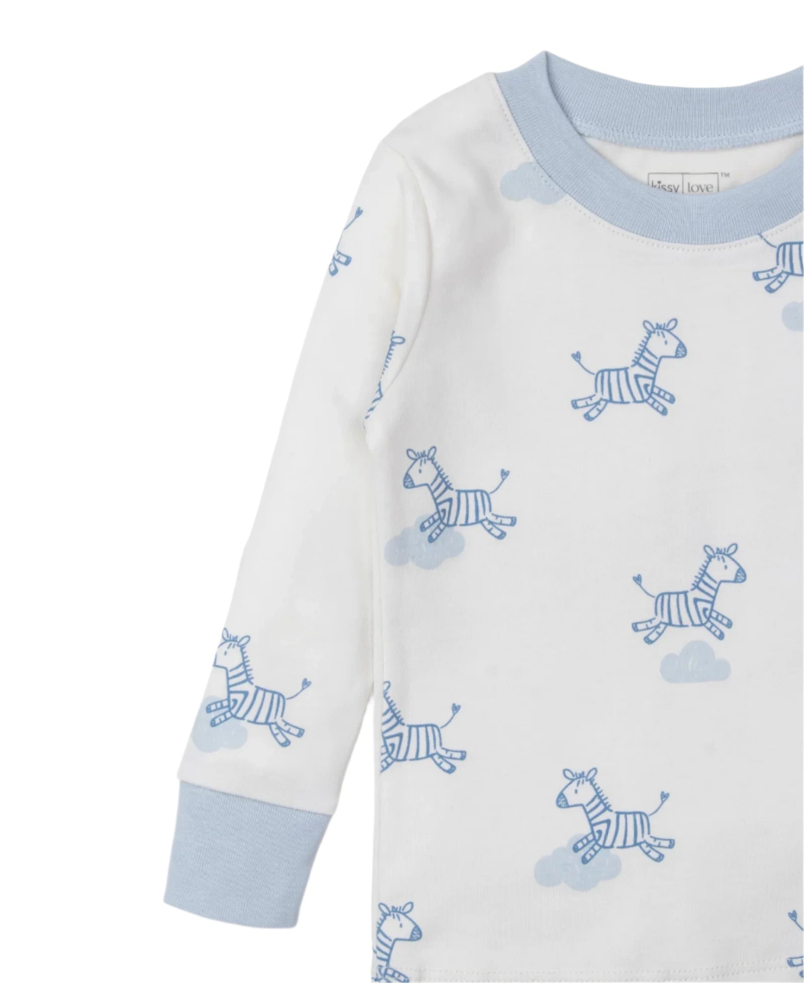 The Kissy Kissy Dreamy Zebras Toddler Pajama Set includes a white long-sleeve shirt made from soft Pima cotton, featuring light blue cuffs and neckline with dreamy zebras among fluffy clouds, perfect for a cozy night.