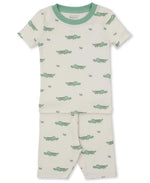 The Kissy Kissy Baby Boys’ and Boys’ Crocodile Walk SS Pajama Set is a cream, short-sleeved Pima cotton pajama with green trim and a playful small green crocodile print.
