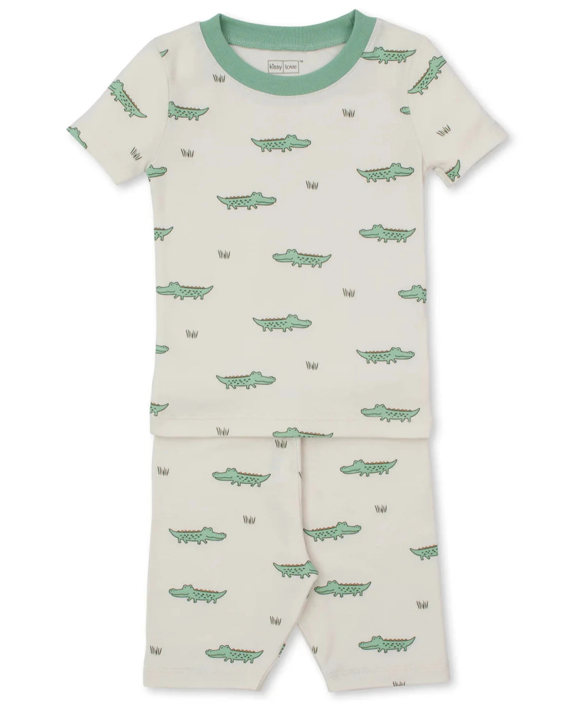 The Kissy Kissy Baby Boys’ and Boys’ Crocodile Walk SS Pajama Set is a cream, short-sleeved Pima cotton pajama with green trim and a playful small green crocodile print.