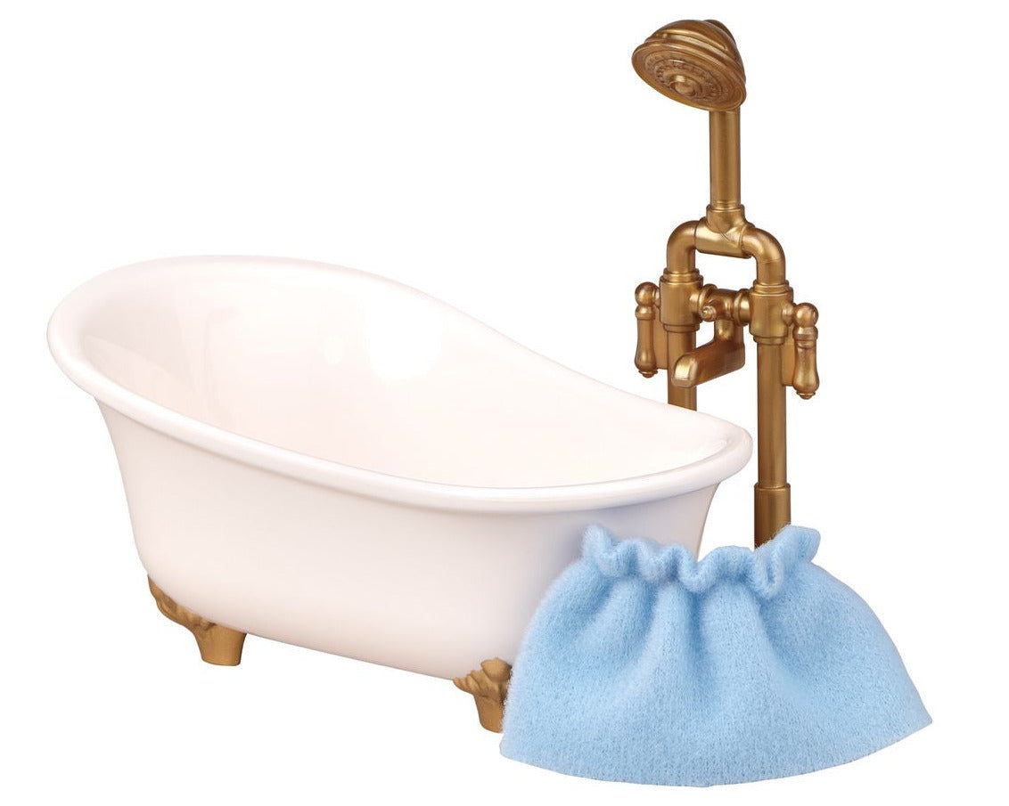 A small white clawfoot bathtub with gold fixtures and shower head, placed beside a light blue cloth pouch against a white background—an ideal addition to your Calico Critters Red Roof Cozy Cottage, perfect for bath time fun with your Chocolate Rabbit girl.