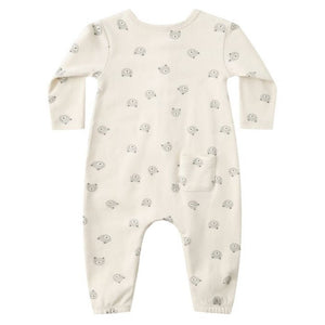 The Quincy Mae Baby Long Sleeve Jumpsuit in cream features a bear face print, a small front pocket, and coconut buttons, shown on a white background.