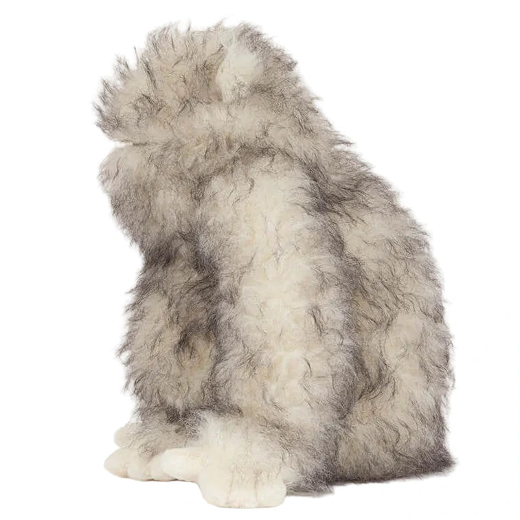The Jellycat Bretti Yeti is a plush toy with soft grey and white fur, shaped like Bretti Yeti's sacred protector. It sits upright, facing left.