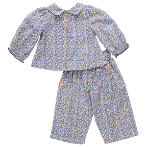 The Baby Girls' Dawson 2-Piece Set by Pink Chicken features a blue climbing floral print on soft cotton poplin with a long-sleeve buttoned top and matching pants.