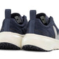 Rear view of a pair of Veja Junior Canary Alveomesh Sneakers by Veja in dark blue, featuring white soles and pull tabs on the heel. The shoes incorporate mesh fabric, branding on the sides, and Amazonian rubber for enhanced sustainability.