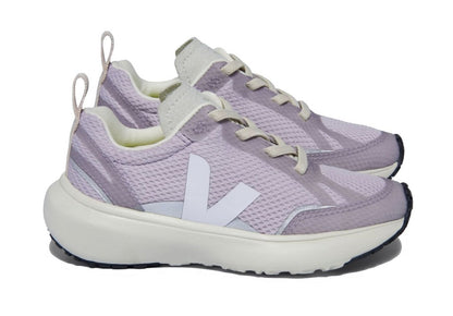 A pair of Veja Junior Canary Alveomesh Sneakers featuring lilac fabric, white soles, white laces, a white 'V' logo on the side, crafted from sustainable materials and Amazonian rubber.